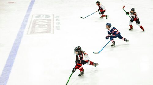 Female Ice Hockey Players in Action on Rink 4K Wallpaper