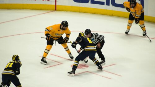 Intense Ice Hockey Face-Off Match Action 4K Wallpaper