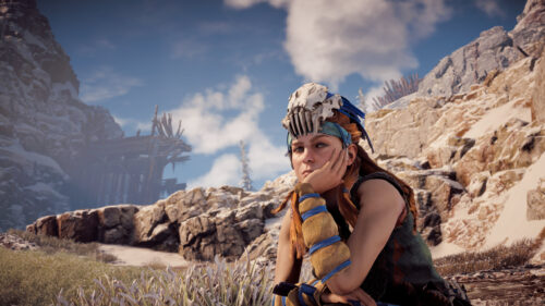 Aloy from Horizon Zero Dawn Resting in Snowy Mountain Landscape PC Wallpaper