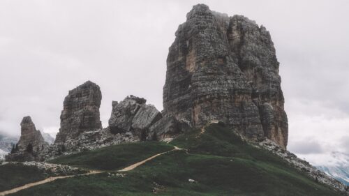 Majestic Dolomite Peaks and Alpine Hiking Trail Desktop Wallpaper