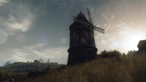 Rustic Medieval Windmill in Golden Hour Landscape PC Wallpaper