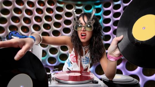 Energetic Female DJ Playing Vinyl Records in Retro Style PC Wallpaper