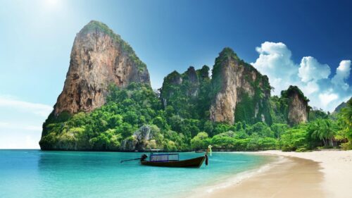 Breathtaking Tropical Beach with Longtail Boat in Thailand 4K Wallpaper