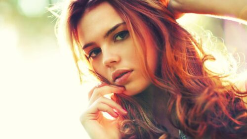 Beautiful Woman With Red Hair In Sunlit Bokeh Background 4K Wallpaper