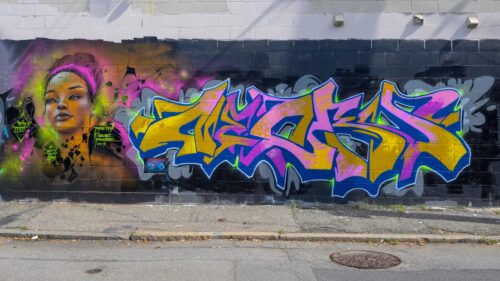 Vibrant Urban Graffiti Mural with Woman Portrait PC Wallpaper