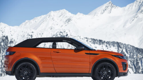 Orange Range Rover Evoque Convertible in Snowy Mountains PC Wallpaper