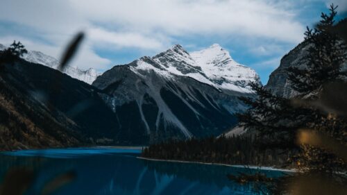 Majestic Snow Capped Mountain Peaks Over Pristine Lake Desktop Wallpaper