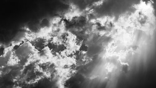 Dramatic Black and White Stormy Sky with Sun Rays 4K Wallpaper