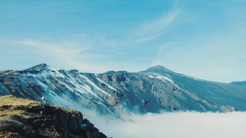 Majestic Volcanic Landscape with Snow and Clouds 4K PC Wallpaper