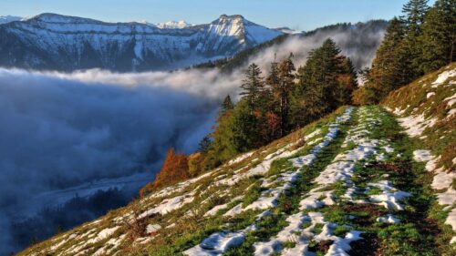 Breathtaking Snowy Alpine Mountain Trail Above Clouds PC Wallpaper