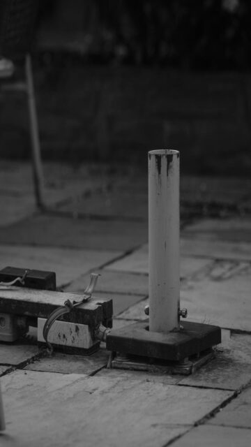 White Pole on Stone Patio