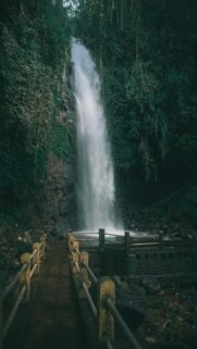 Ethereal Waterfall Cascading Down Rocky Cliff Face
