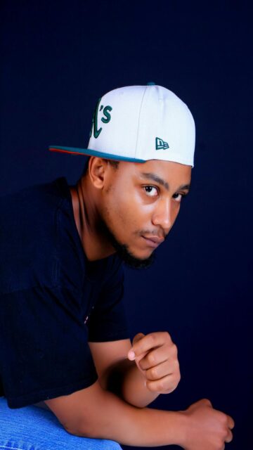Man in White Baseball Cap and Black T-Shirt