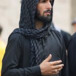 Mourning on Ashura: Man in Black Traditional Clothing