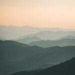 Mountainous Sunset Under White Mist
