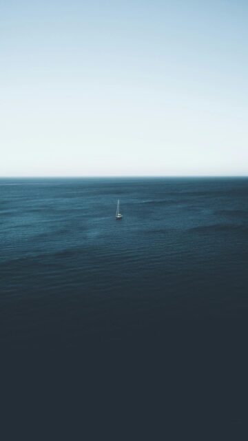 Sailboat On Body Of Water During Daytime - A Calming Mobile Wallpaper