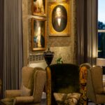 Framed Portraits on Patterned Wall