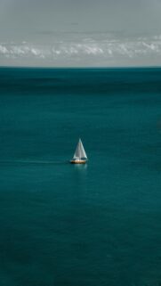 Serenene Scene: White And Brown Boat In Body Of Water