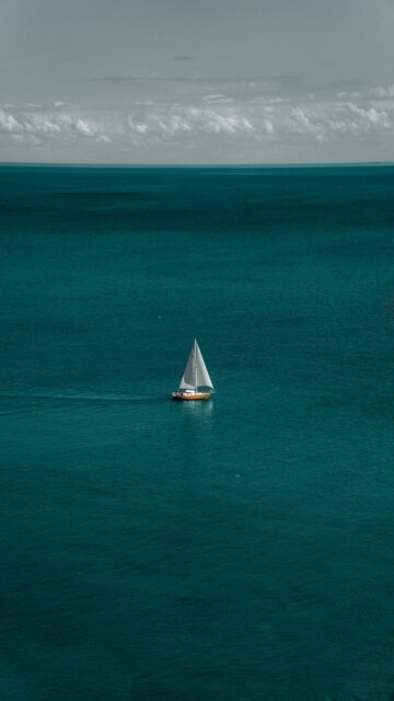 Serenene Scene: White And Brown Boat In Body Of Water
