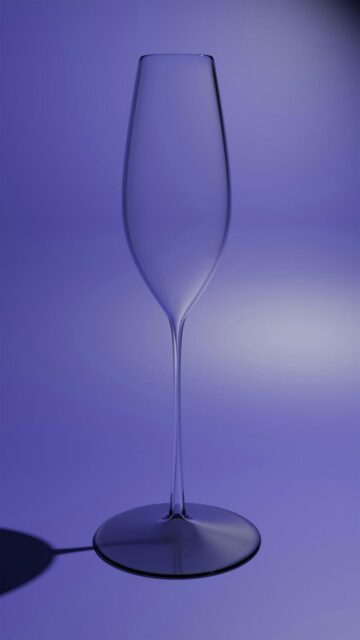 Clear Champagne Flute on Purple Background