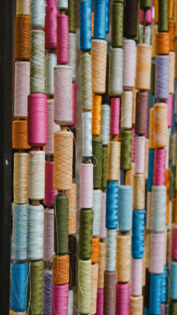 Vibrant Thread Spools Mobile Wallpaper