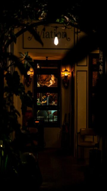 Nighttime Bar Entrance Mobile Wallpaper