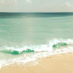 Coastal Serenity: Gentle Waves on a Sandy Beach