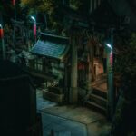 A Japanese Shrine Illuminated At Night