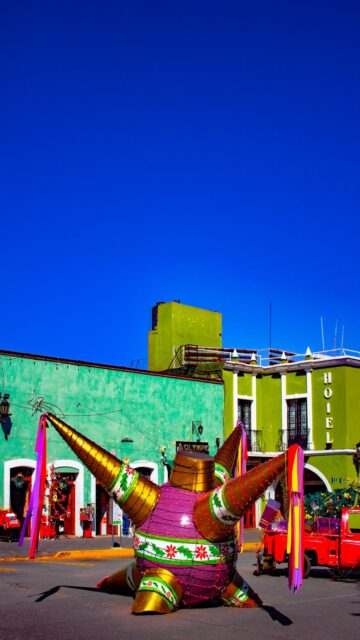 Vibrant Piñata in Front of Buildings