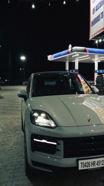 Light Grey Porsche Cayenne at Gas Station
