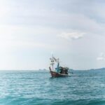 Vast Ocean Scenic Wallpaper - Lonely Fishing Boat