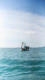 Vast Ocean Scenic Wallpaper – Lonely Fishing Boat