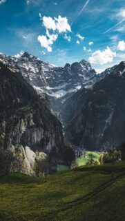 Lush Green Valley Amidst Majestic Mountains