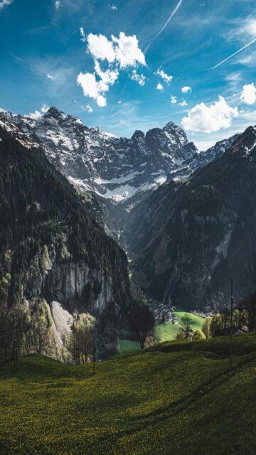 Lush Green Valley Amidst Majestic Mountains