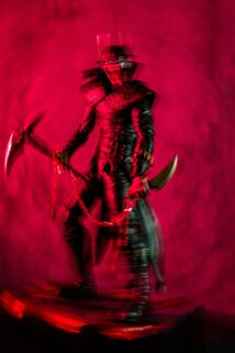 A Menacing Figure In Dark Armor With Red Lighting – Free 4K HD Download
