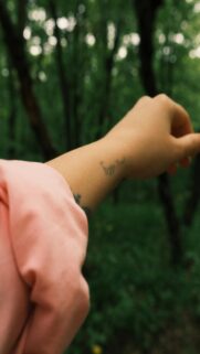 Nature-Inspired Tattoo in Forest Landscape