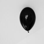 Minimalist Mobile Background: Single Black Balloon