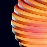 Vibrant Orange and Pink Discs on Black Background