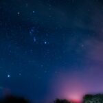 Starry Night Sky Over A Winding Road
