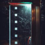 Vintage Phone Booth at Night with Graffiti