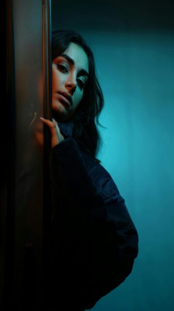 Dramatic Moment: A Woman Leans Against a Wall