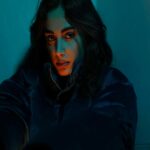 Dark Hair Illuminated by Blue Light