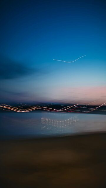 Dusk Light Trails Over Water