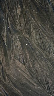 Abstract Dark Wet Sand Patterns