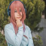 Anime Cosplay with Headphones and Pink Hair Mobile Wallpaper