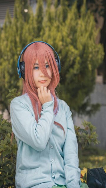 Anime Cosplay with Headphones and Pink Hair Mobile Wallpaper