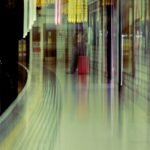 Urban Commute: Blurred Subway Station with Way Out Sign