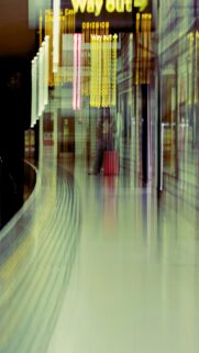 Urban Commute: Blurred Subway Station with Way Out Sign