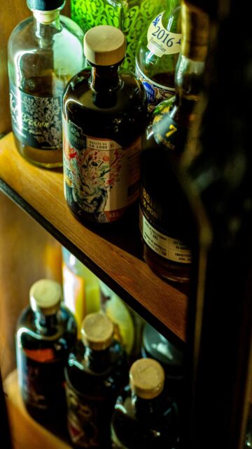 Spirited Selection: Wooden Shelf Bottles of Liquor