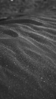 Stunning Black Sand Dunes with Glittering Particles